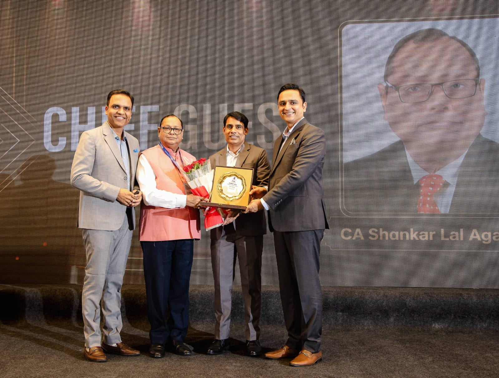 Founders felicitating the chief guest at MSME Growth Summit 2026