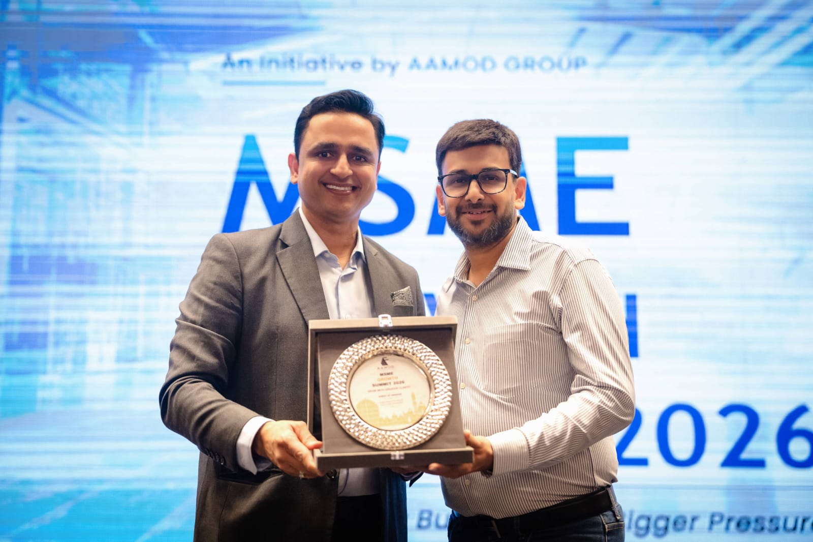 Ankit Goyal presenting a memento to a guest