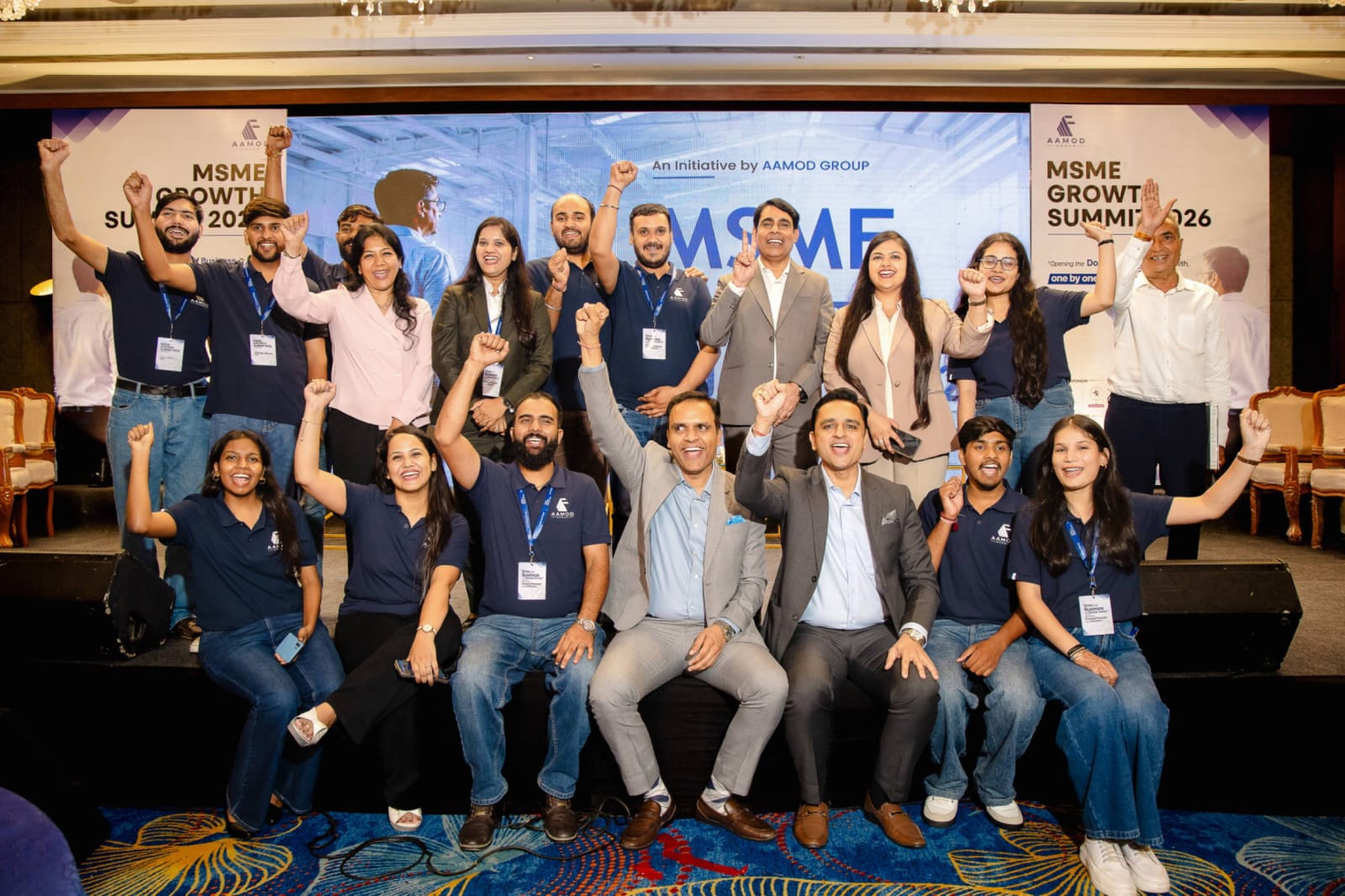 AAMOD Group team celebrating on stage at MSME Growth Summit 2026