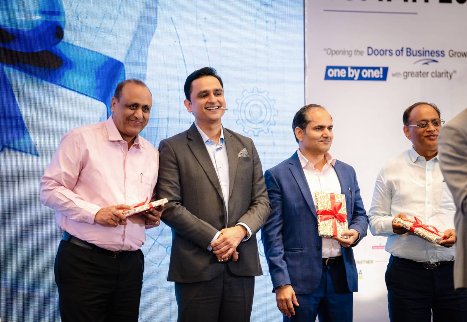 Guests receiving gifts on stage at MSME Growth Summit 2026